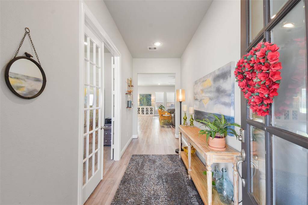 Covered patio. Great for decorating. Beautiful wood and glass door.