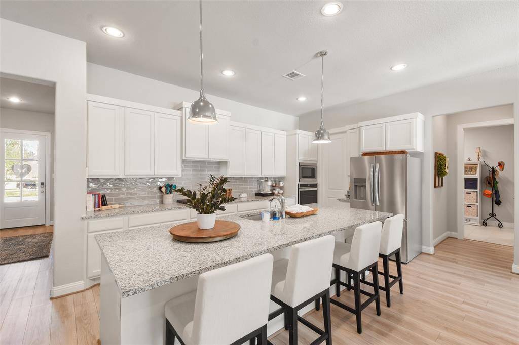 Study is located at the front of the home with french doors for privacy.