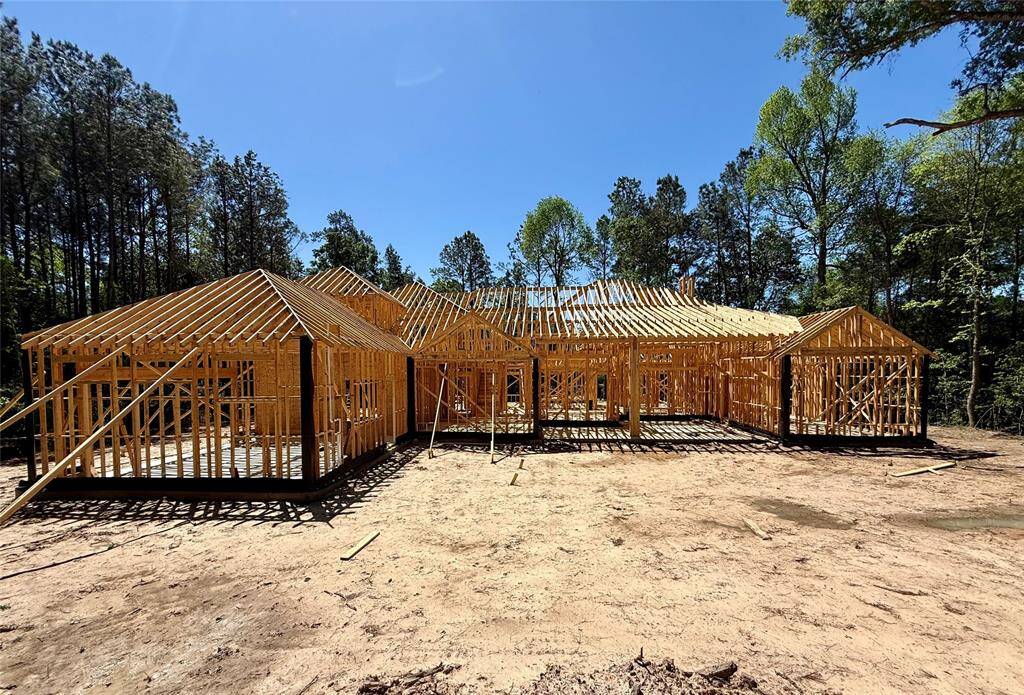 View of the back of the home. Plenty of space for a pool with room to spare.