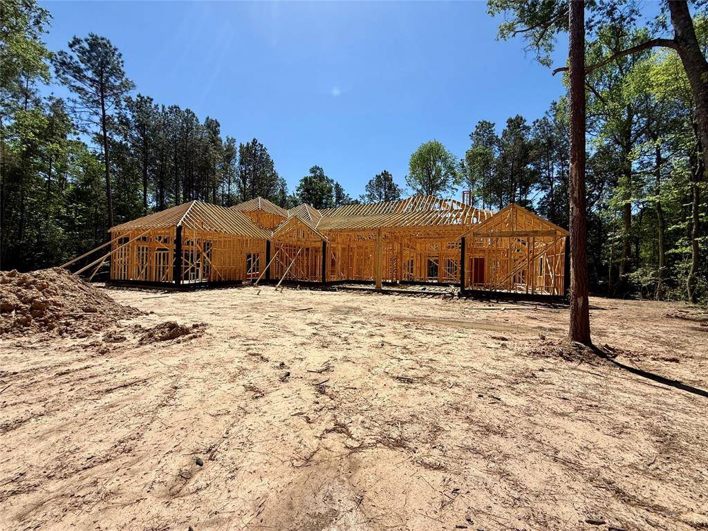 Expanded view of the rear of the home, and part of the backyard.