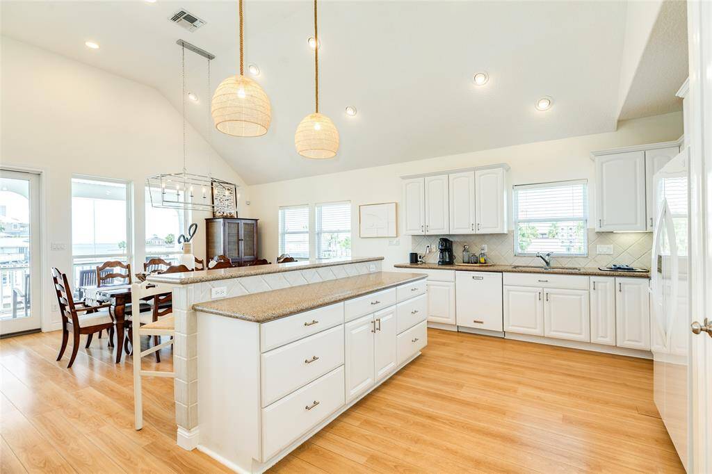 The large island has ample storage and enjoys great bay views