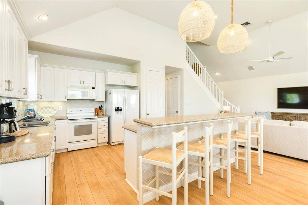 The breakfast bar seats five and offers the perfect spot for a quick bite or an easy way visit with the cook.