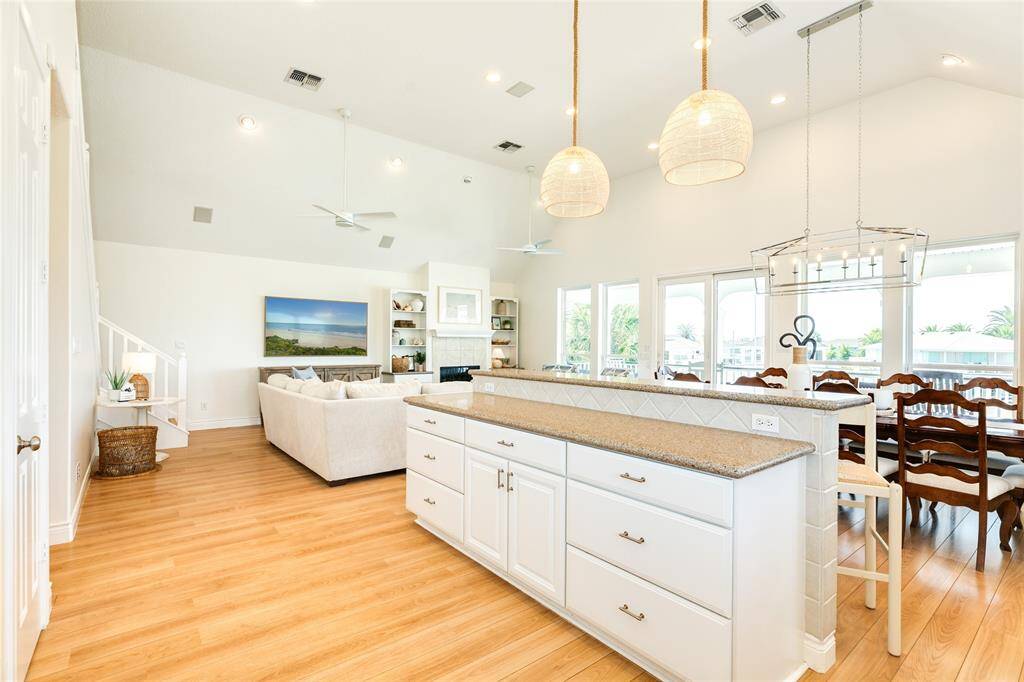 The easy care wood floors flow throughout the home's large public areas and add to the coastal laid back vibe.