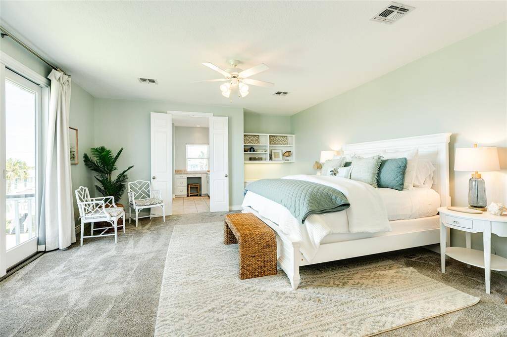 The owner's suite. Sweeping space, convenient touches, a private balcony with jaw-dropping views, and plush NEW carpets.