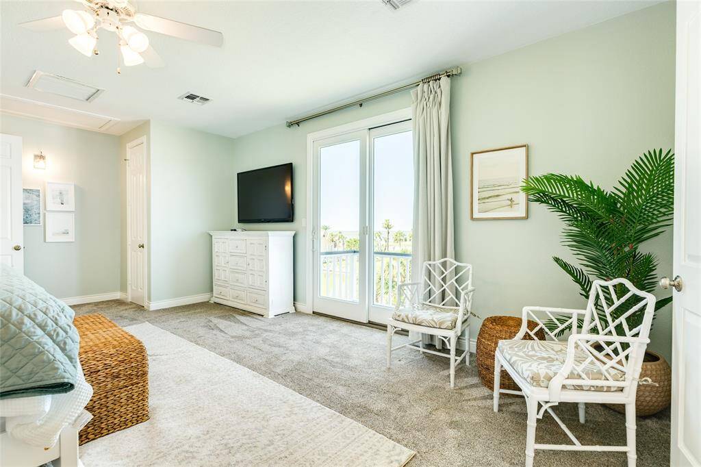The door on the left is to a secondary walk-in closet. The sliders lead to an awesome balcony view for morning coffee.
