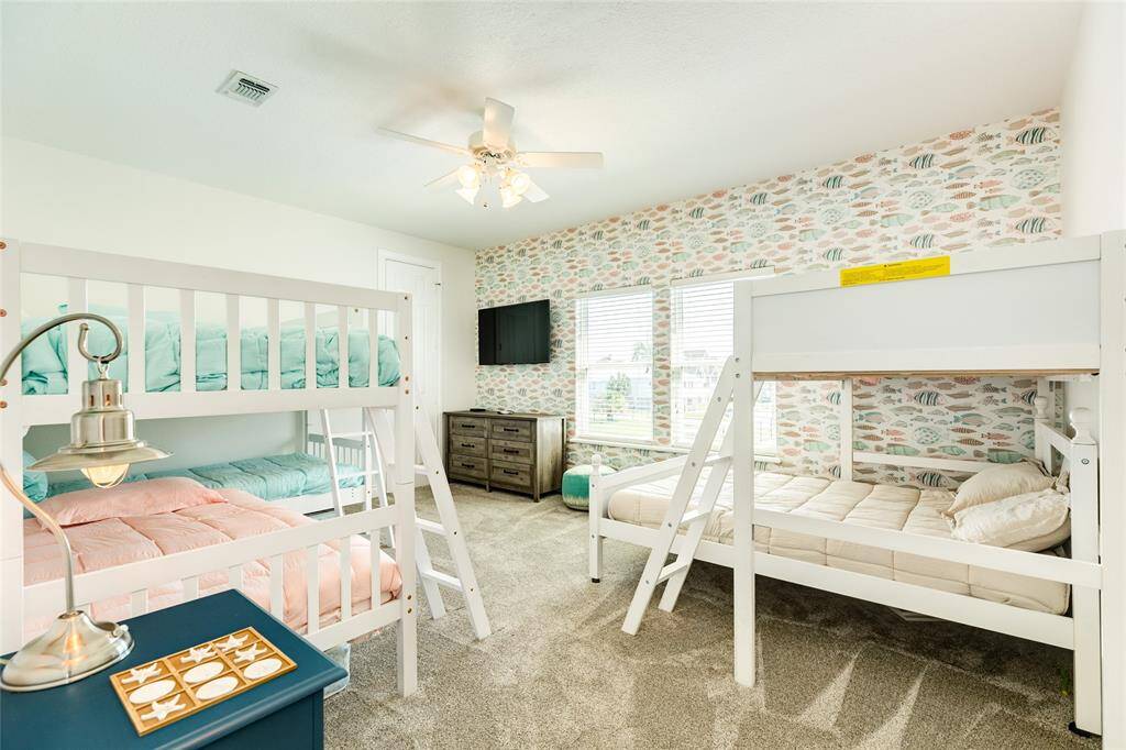 The bunk room features room for the whole squad, a walk-in closet, and NEW carpet.