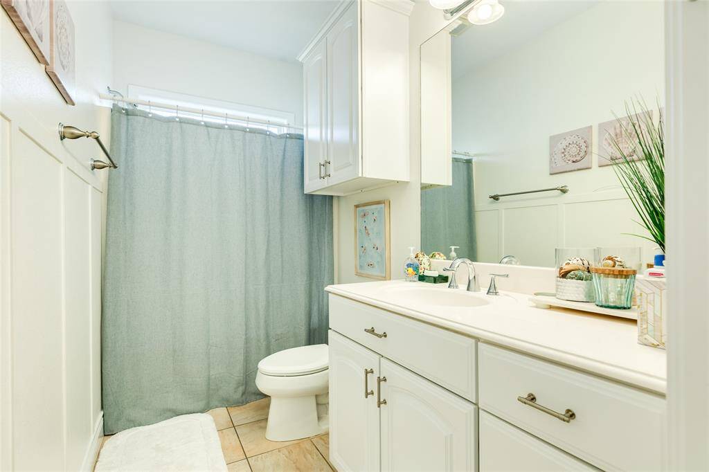 The hall bath serves the main public area, the guest room, and the bunk room.