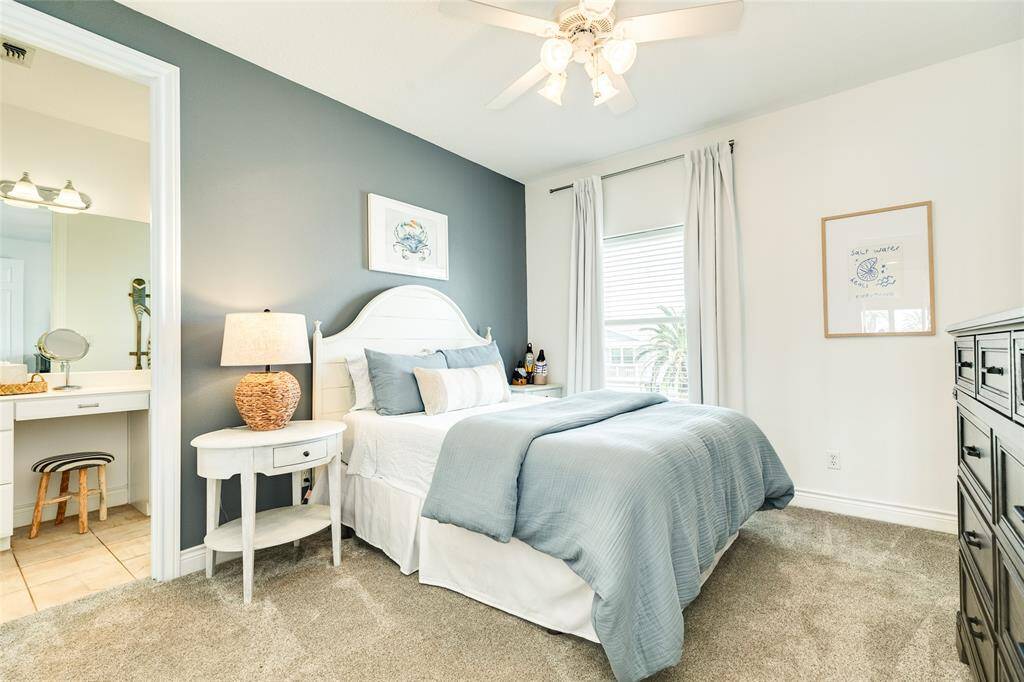 The guest primary is on the main level and features a walk-in closet and makeup vanity. All carpets in the house are NEW.