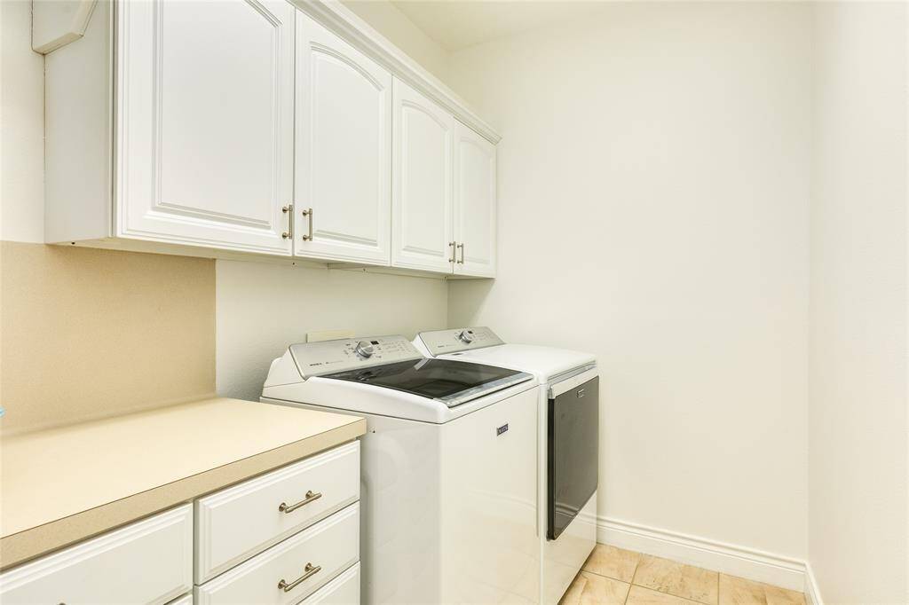 HUGE laundry room with lots of storage on main level.