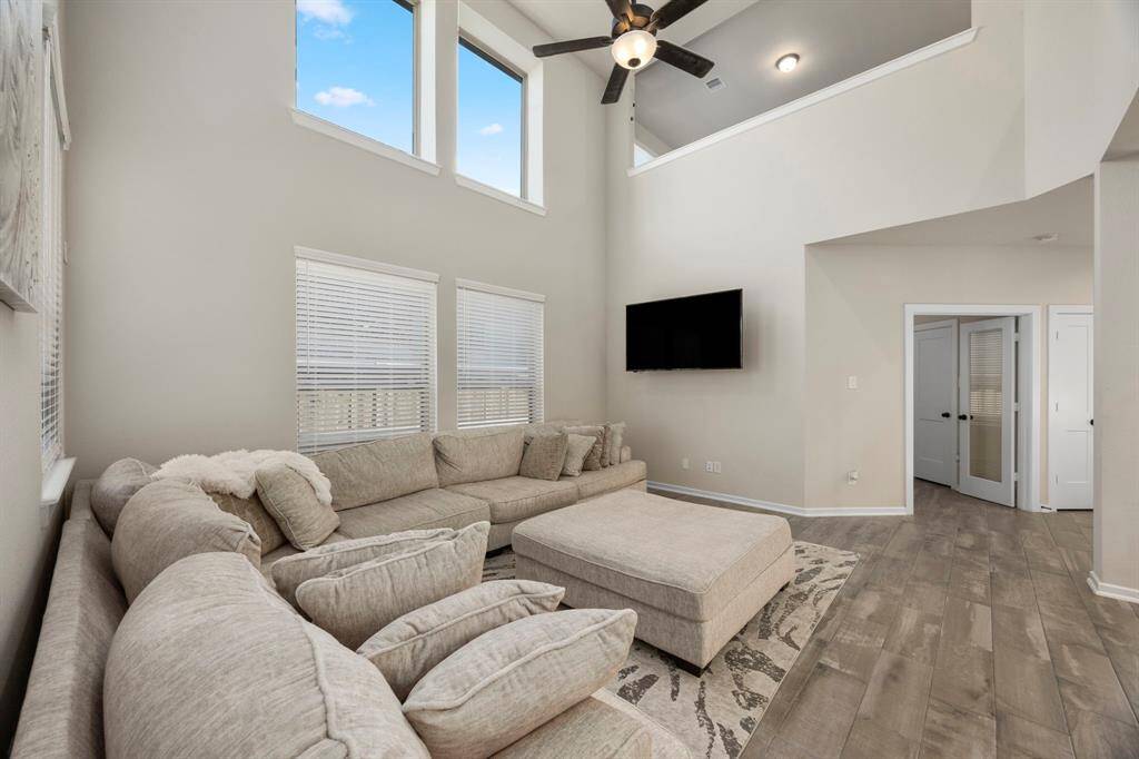 Ceilings to the second floor, tons of natural lighting, and overlook from the game room/ second living area upstairs.