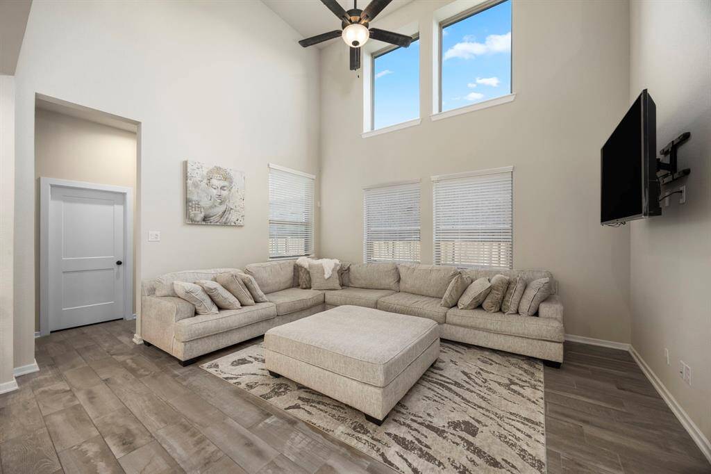 Large second story windows, lighting up this gorgeous living area.