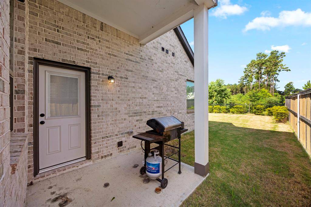 Covered patio area. Door leading off from a private hallway just off the utility room.