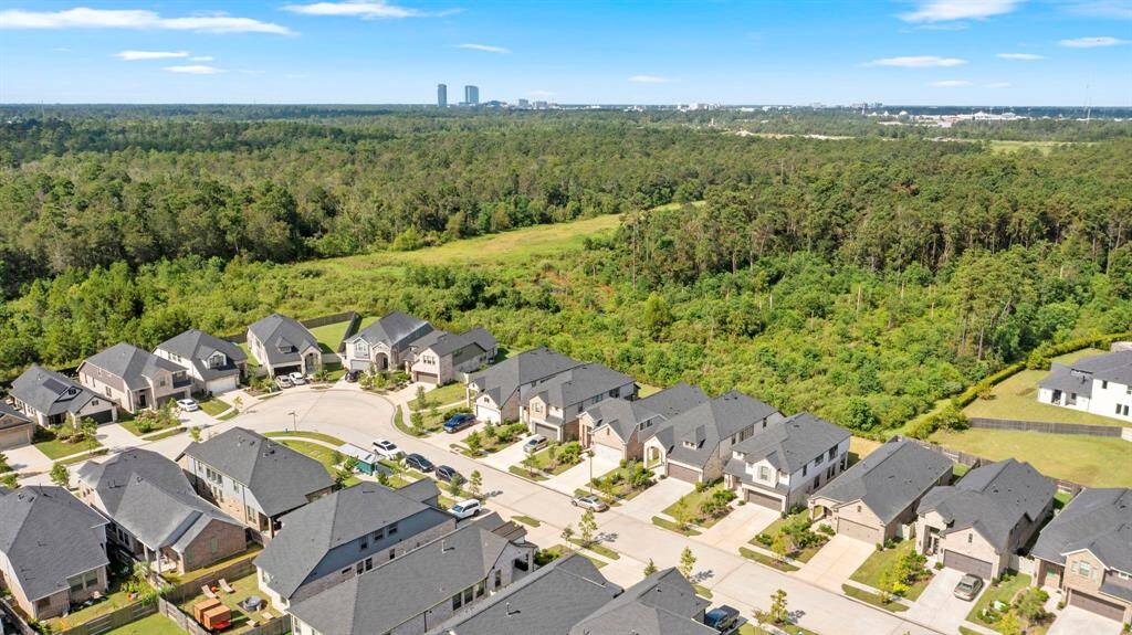 You can see the towers of The Woodlands. Very close proximity to all.
