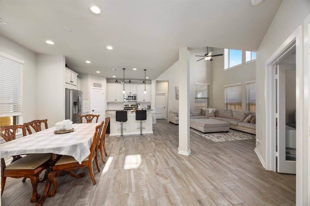 Large open floorpan. Column separating the dining, kitchen, and living area.