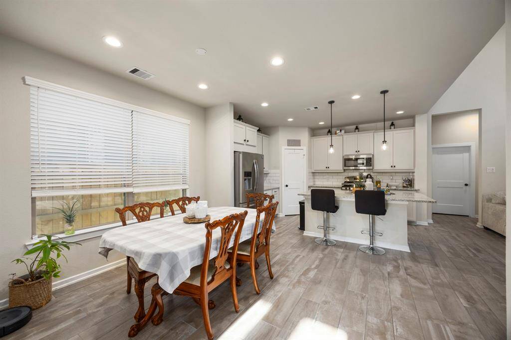 Kitchen area and kitchen view. Wired for a beautiful chandelier to place over your table.