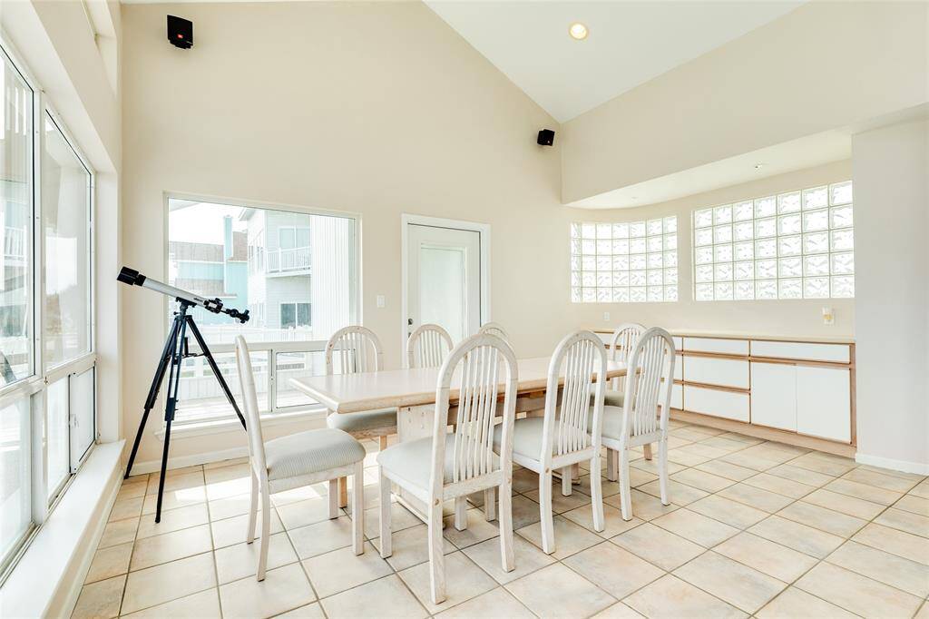 This view of the dining room shows the built-in buffet and door coming in from the deck. Just beyond that door is the perfect elevator shaft, currently used as deck level storage.