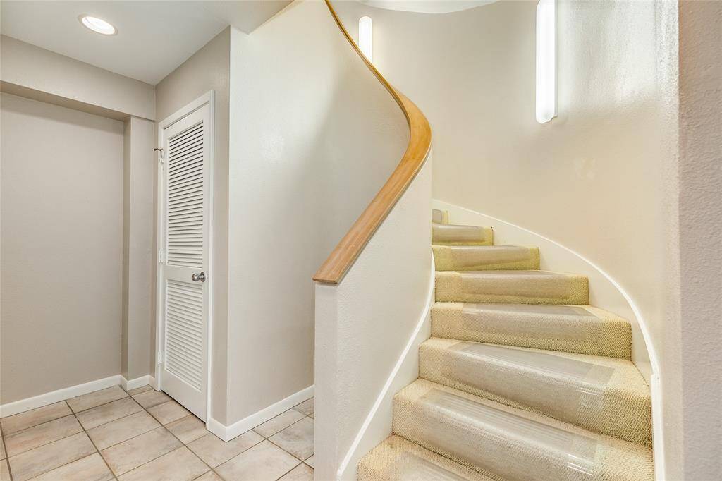 The foyer of the home features a dumb waiter for convenience, a coat closet, and a large storage space.