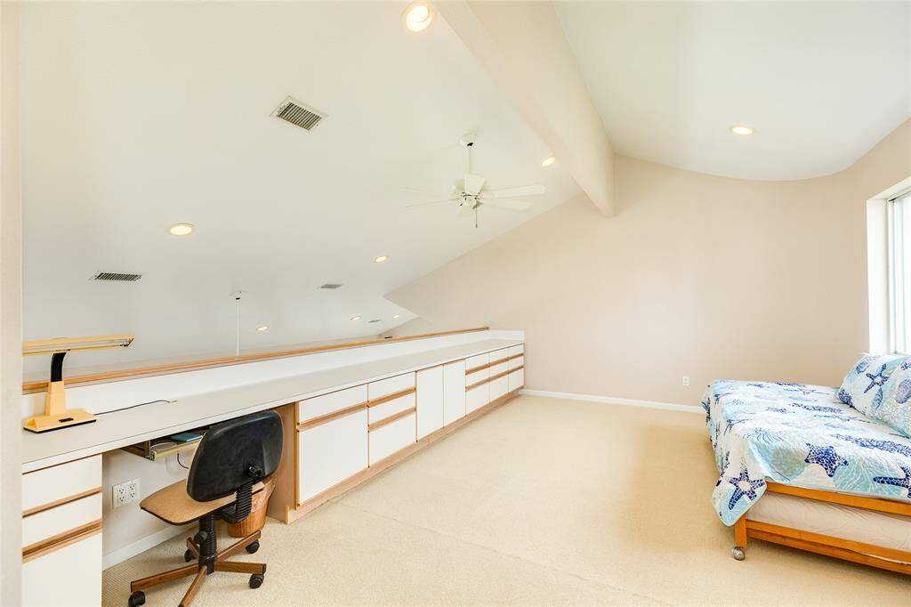 The loft/extra room is quite large. The space features tons of room for arts and crafts, work from home space, or whatever you need. This would be a great game room, yoga studio, or use it as a separate sleeping quarter for overflow guests!