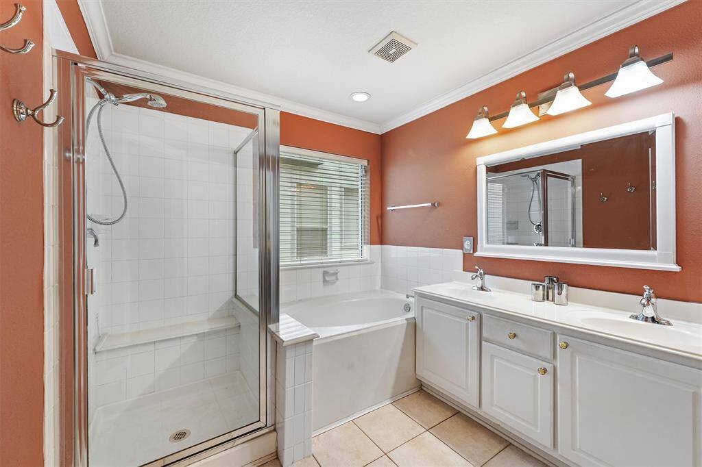 Master bathroom has separate shower with large soaking tub.