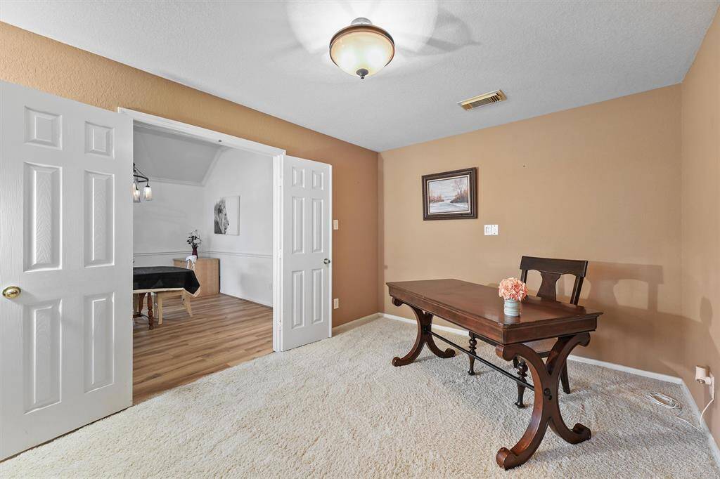 Office with double solid doors could be used for 4th bedroom.