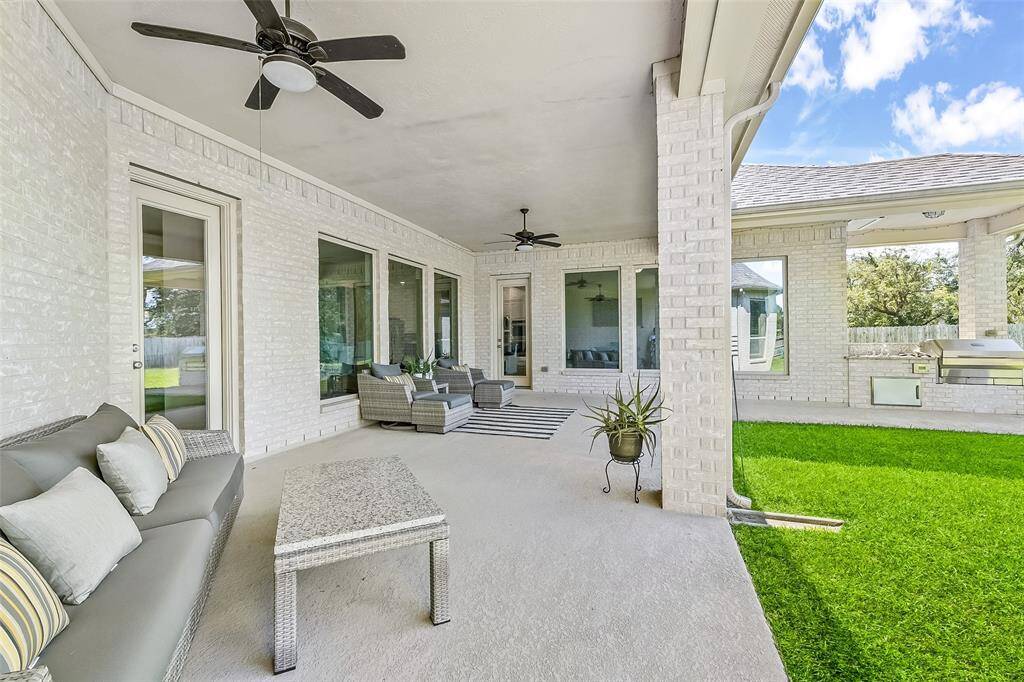 Oversized covered patio with outdoor grill