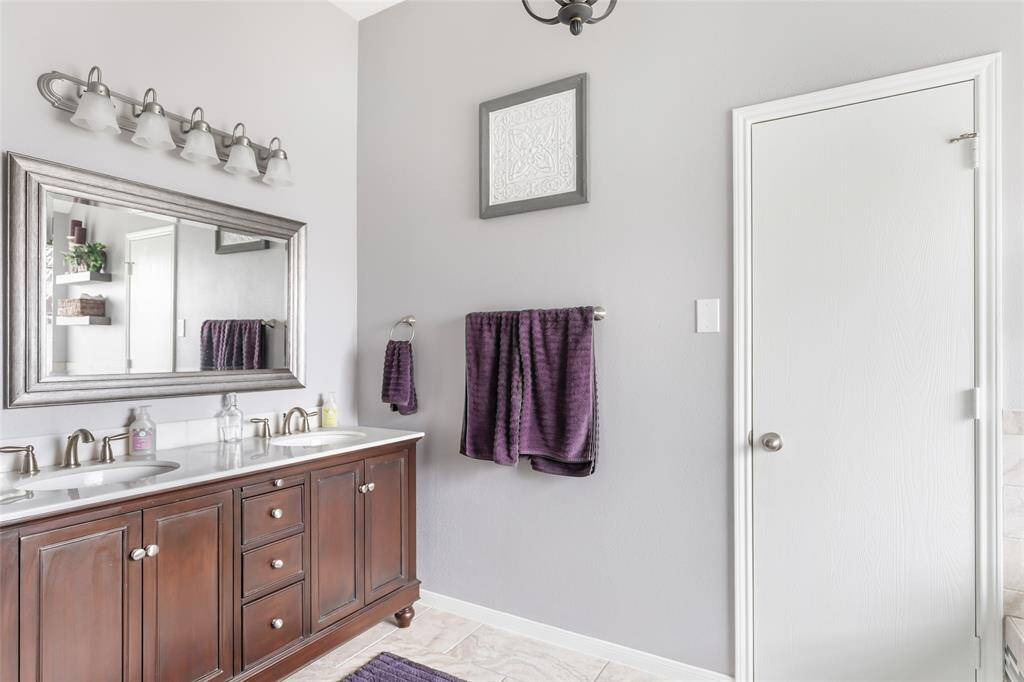 Luxurious primary bathroom with elegant finishes