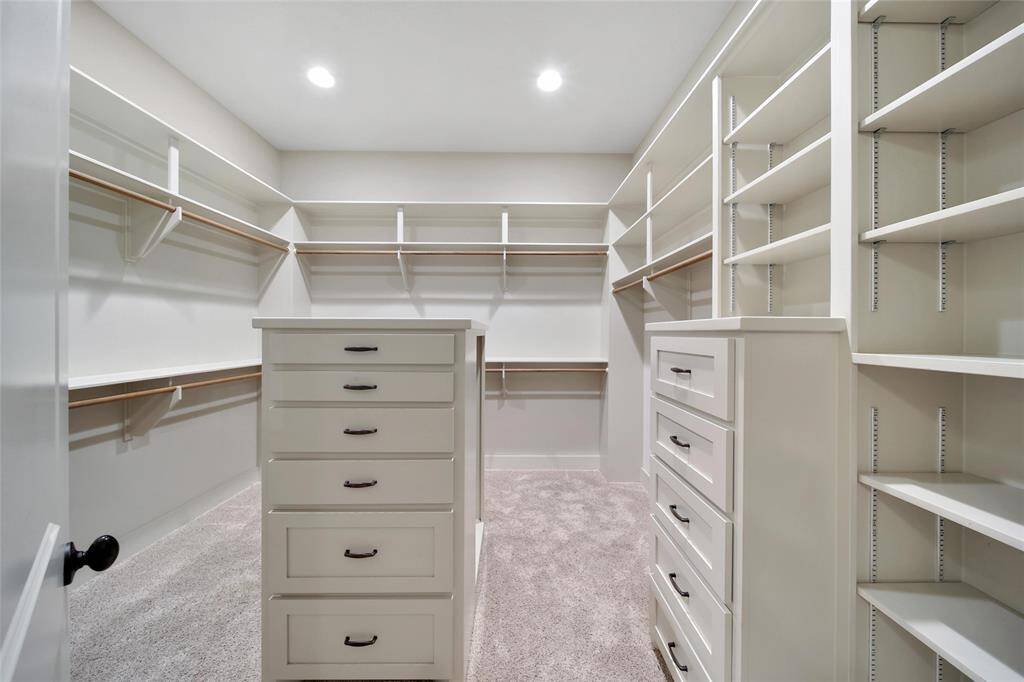 A designers closet!!!! Located in the primary en-suite