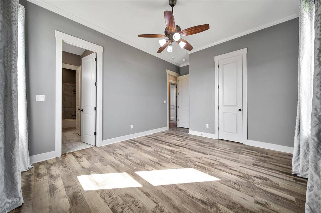Located across the home, here is one of the bedrooms. The windows face the front of the house.