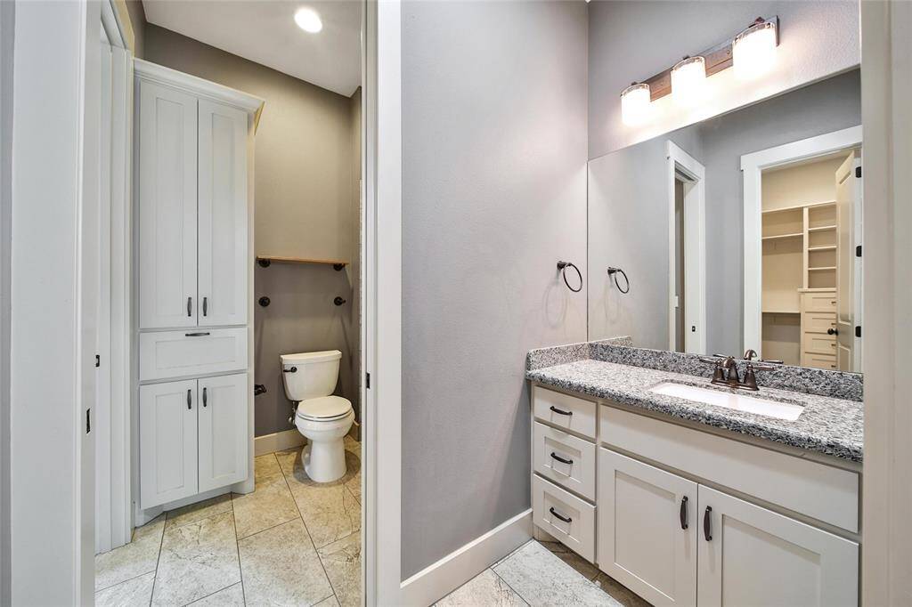 The vanity and dressing area for bedroom number two.