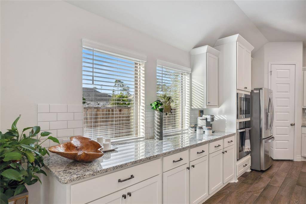 A mirror image view of these awesome cabinets in this home!