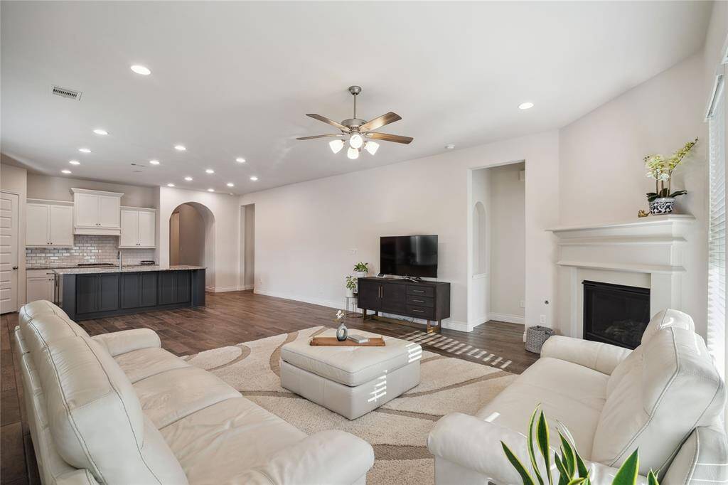What was an option, is and elegant gas log Fireplace in a cast stone surround, bringing a special ambience to this beautiful room!