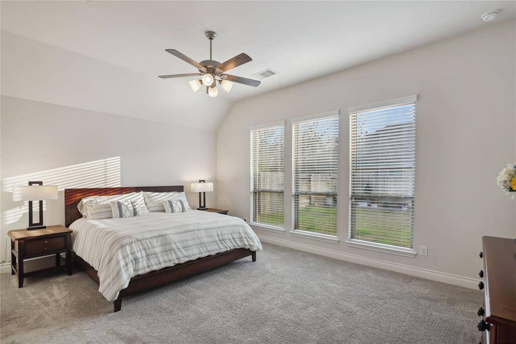 Welcome to your Private 18'x14' Primary Bedroom with beautiful windows bringing in the natural sunlight! This room is located at the back of the home.