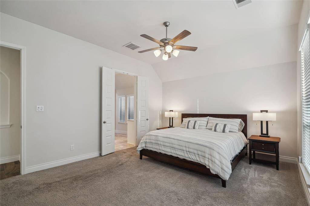 Notice the art niche in the hall and left of the Primary Bedroom. Double doors lead to your serene Bath!