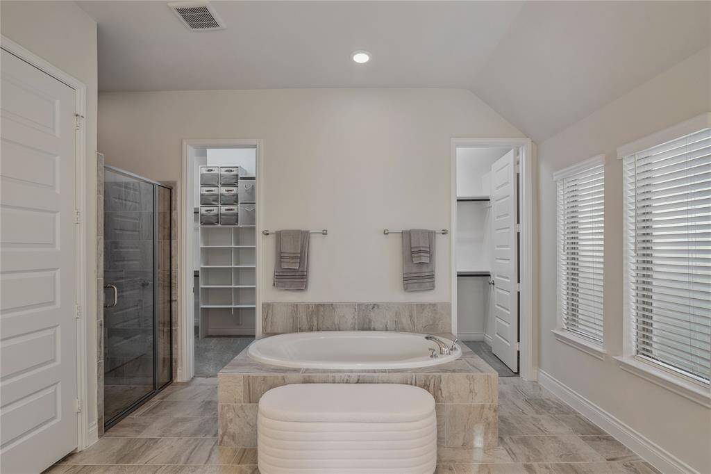 You have arrived in this gorgeous spa-like room with a large soaker tub for complete relaxation!