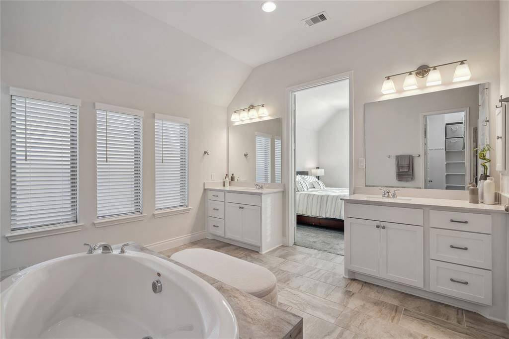 Generous and separate vanities offer your own space!