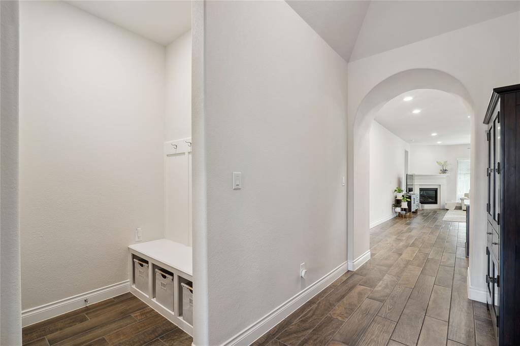 A well-appointed mud room is conveniently located in front of the garage entrance for ease of removing outerwear and shoes!