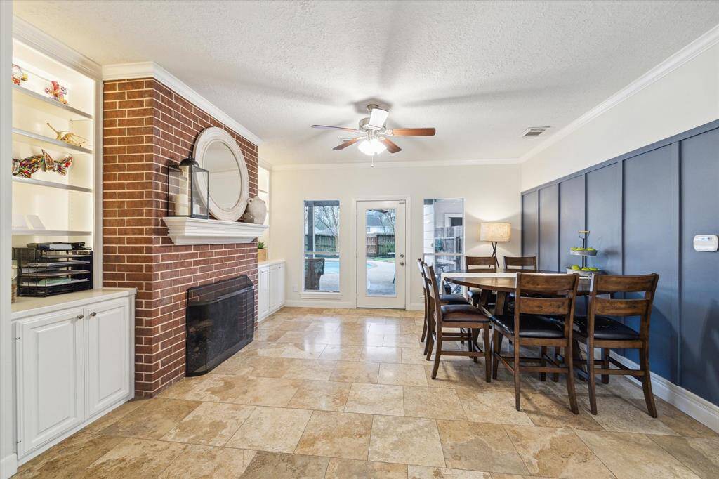 Versatile great room open to kitchen is being used as a breakfast/hearth room. Could also be cozy tv den