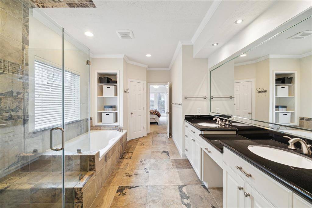 Primary bath with seamless glass shower and large tub