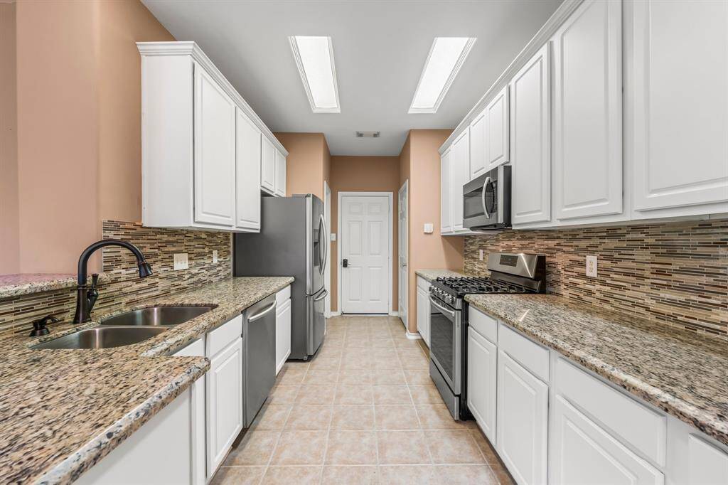 The cool clean lines in the kitchen are sure to impress! The glass and tile backsplash provides class and functionality, and there are two huge pantries to hold all your appliances and cooking supplies. The stainless double-bowl sink with pull-out sprayer and built-in soap dispenser makes clean up a breeze!
