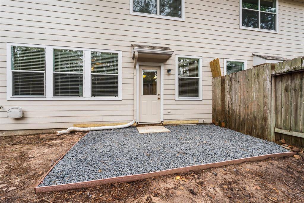 The backyard is headlined by this large patio. There is plenty of room for your grill and dining table and chairs.