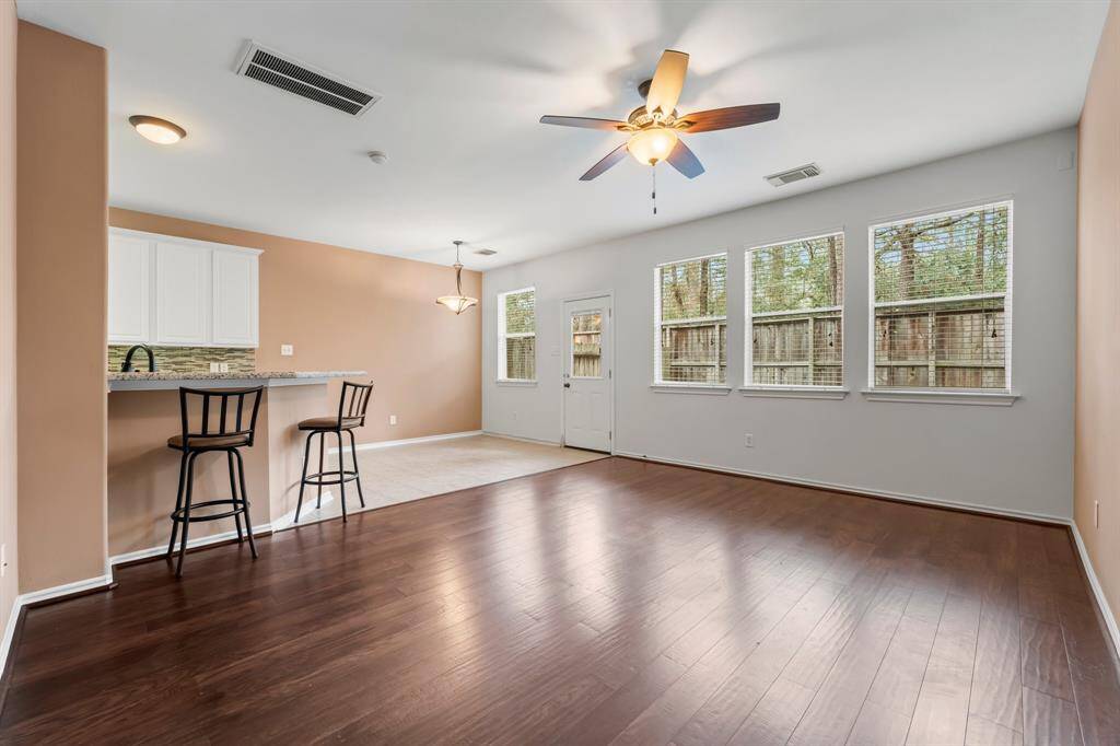 An inviting Family room is a great place to relax with three sunny windows showcasing the backyard and treed greenbelt. Click on the movie reel icon, or visit our on-line documents for a QR code to view our walk-through video.