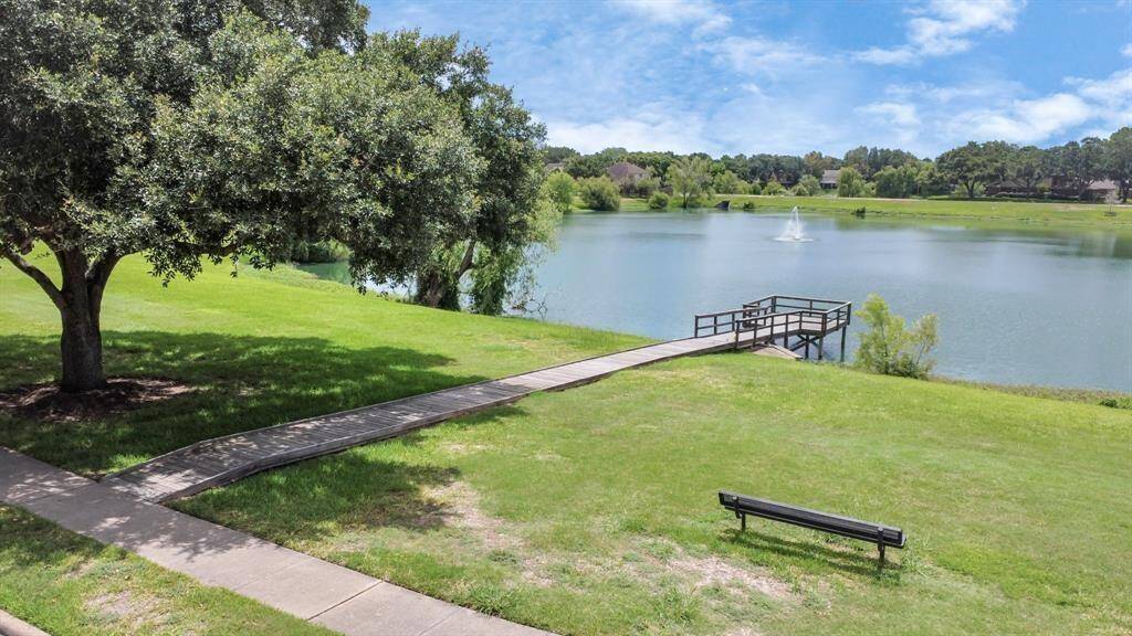 Steps away from a serene community lake.
