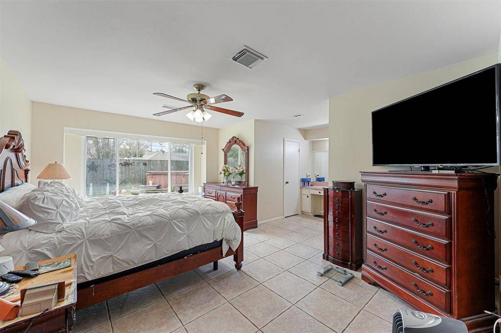 Spacious primary bedroom with tons of natural light.