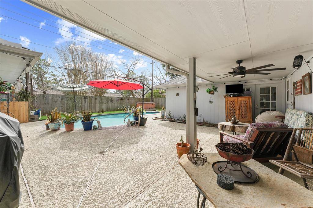 Covered back patio ready for entertaining.