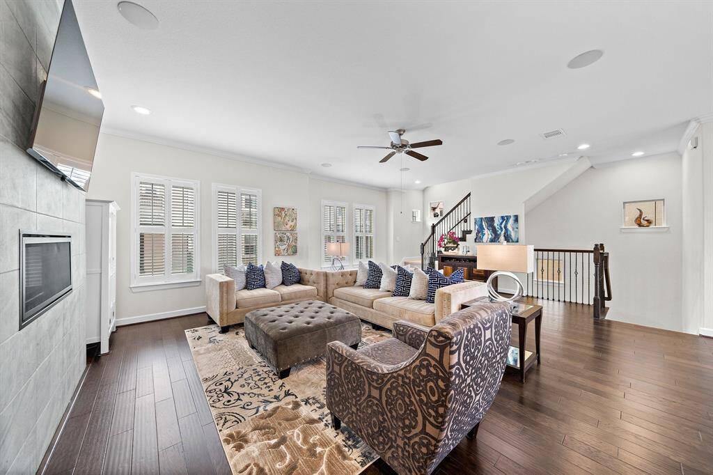 Expansive living area. Gas Fireplace Farmhouse Windows. Open layout makes this home ideal for gatherings.