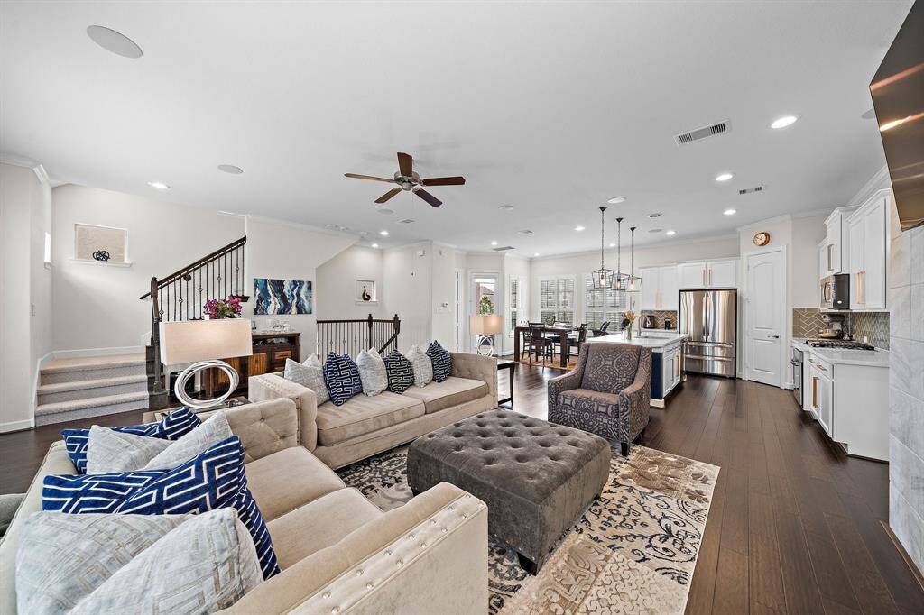 Expansive living area. Gas Fireplace Farmhouse Windows. Open layout makes this home ideal for gatherings.