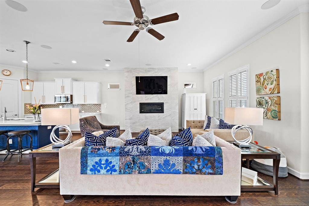 Expansive living area. Gas Fireplace Farmhouse Windows. Open layout makes this home ideal for gatherings.