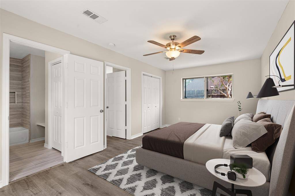 S bedroom is great for use as an in law suite or guest suite features high ceilings, ceiling fan, custom paint, beautiful flooring, direct access to the secondary bathroom and a large window allowing plenty of sunlight throughout the day.