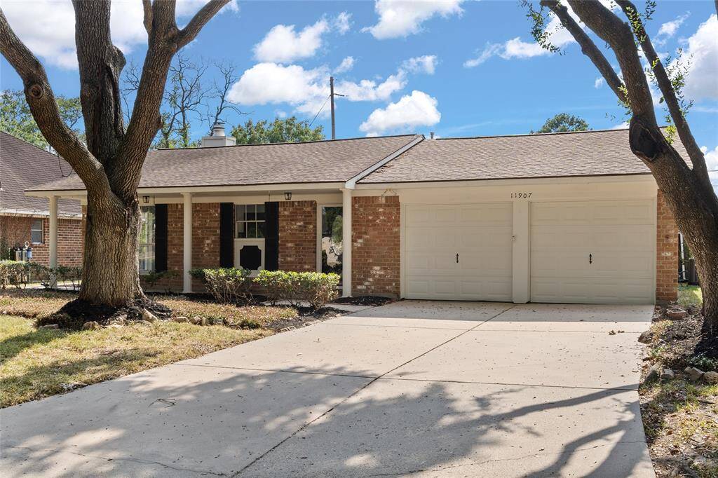 Welcome home to 11907 Windlake Drive located on a quiet cul-de-sac street in Woodedge Village and zoned to Cypress-Fairbanks ISD! This stunning home has lovely curb appeal, a well-manicured lawn, brick elevation, dark stained front door with glass detailing, covered front porch, traditional style, dark stained shutters, beautiful outdoor lanterns, and a double wide driveway!
