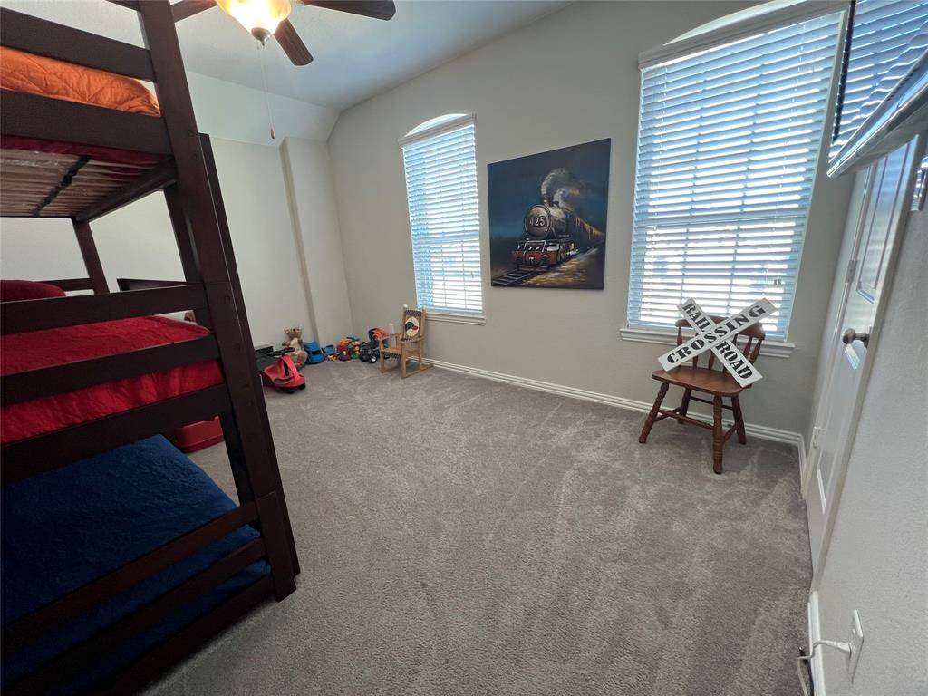 Massive third bedroom is an elegant oasis with warm color scheme.